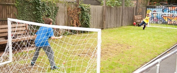Kids playing football website size
